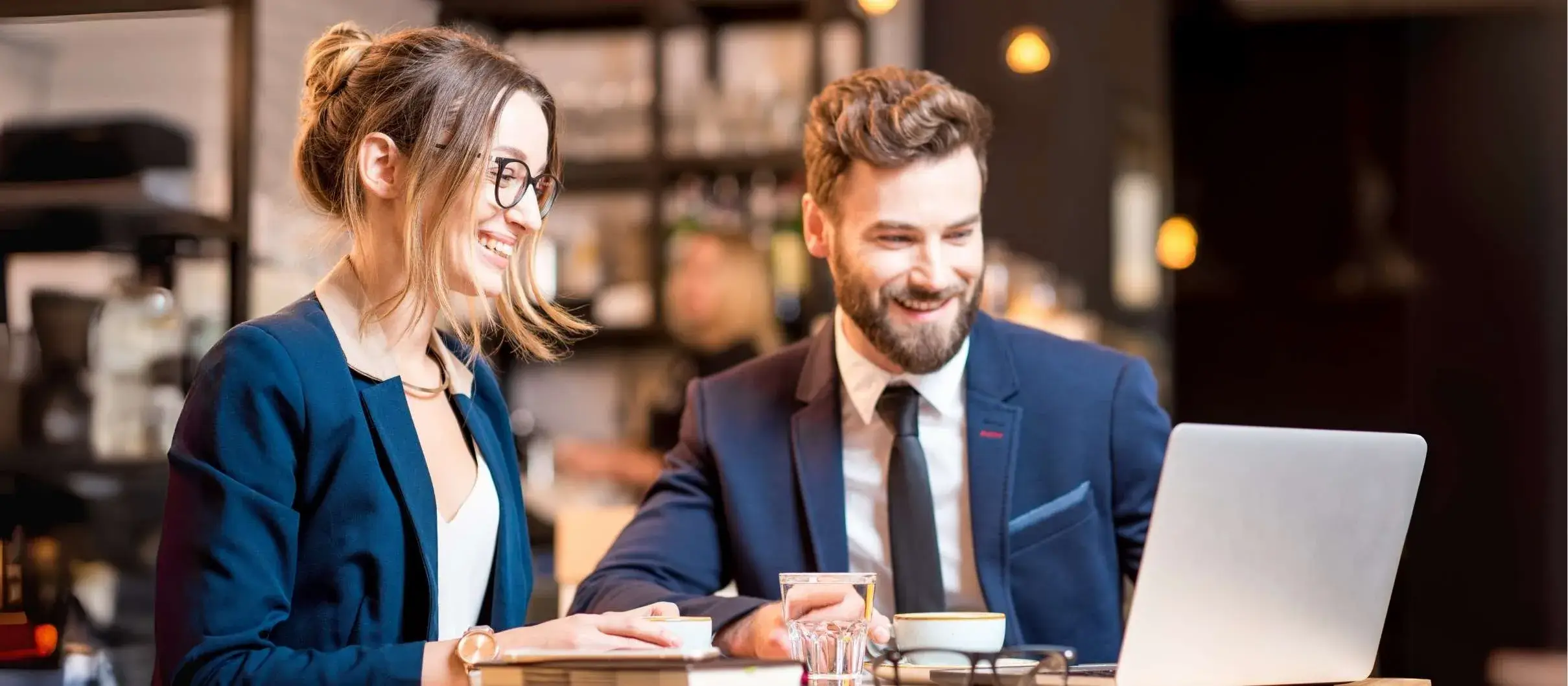 two people discussing soft skills training in a coffeeshop
